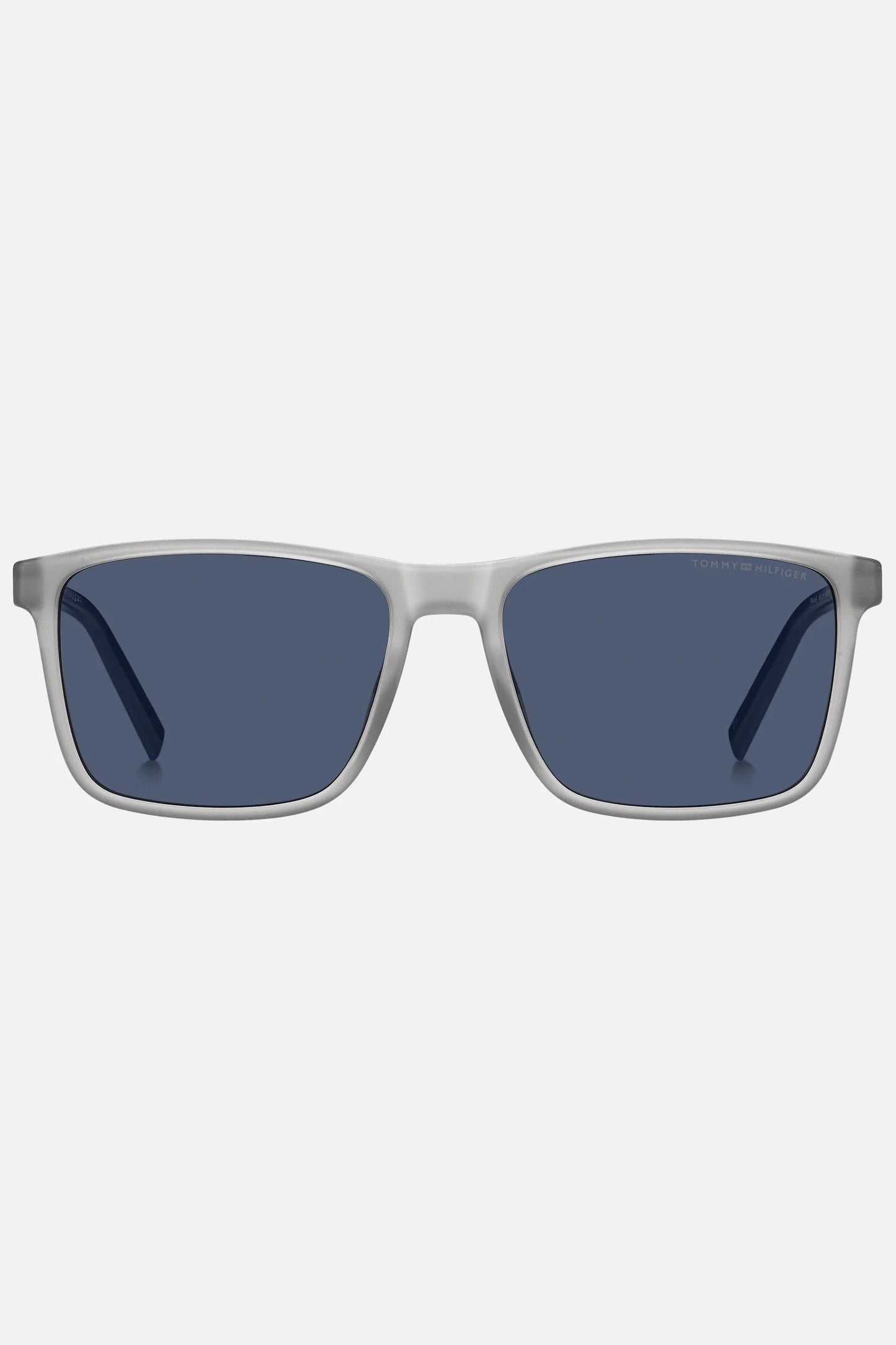 Occhiali da sole Tommy Hilfiger TH 2201/S 09VKU, montatura trasparente opaco con aste blu e lenti blu.