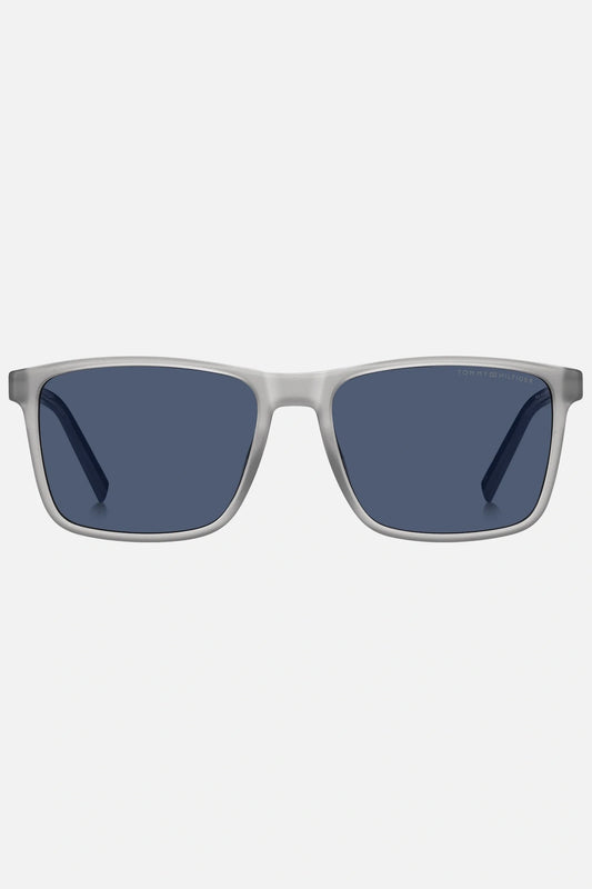 Occhiali da sole Tommy Hilfiger TH 2201/S 09VKU, montatura trasparente opaco con aste blu e lenti blu.