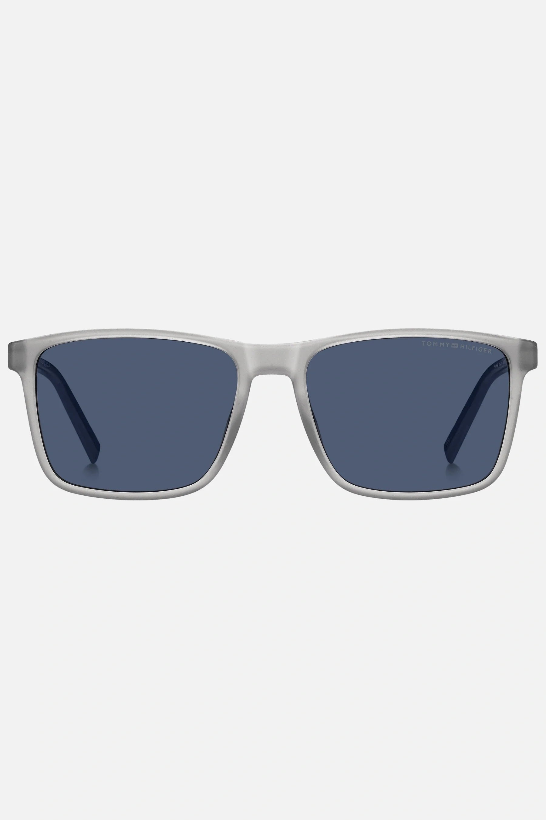 Occhiali da sole Tommy Hilfiger TH 2201/S 09VKU, montatura trasparente opaco con aste blu e lenti blu.