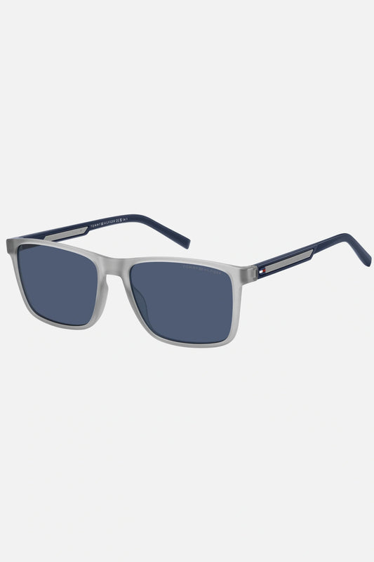 Occhiali da sole Tommy Hilfiger TH 2201/S 09VKU, montatura trasparente opaco con aste blu e lenti blu.